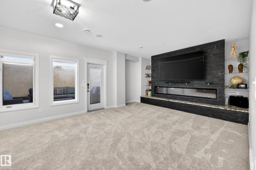 Spacious room featuring light-toned carpeting and recessed lighting - 324 Cutts Crest, Edmonton, AB - Indoor