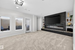 Spacious room featuring light-toned carpeting and recessed lighting - 