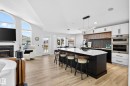 Open-concept living space with light wood-finish flooring - 324 Cutts Crest, Edmonton, AB  - Indoor 