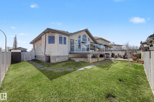 Expansive backyard featuring a manicured lawn and stepping stone pathway - 324 Cutts Crest, Edmonton, AB - Outdoor With Deck Patio Veranda