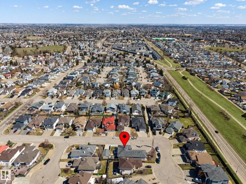 Residential neighborhood featuring a grid of paved streets and numerous detached homes with varying roof styles - 324 Cutts Crest, Edmonton, AB - Outdoor With View