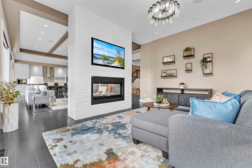 4727 Woolsey Common, Edmonton, AB - Indoor Photo Showing Living Room With Fireplace