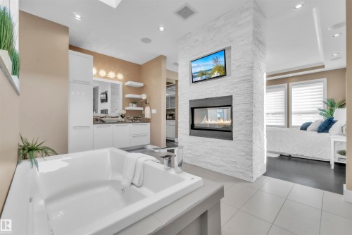 4727 Woolsey Common, Edmonton, AB - Indoor Photo Showing Bathroom With Fireplace