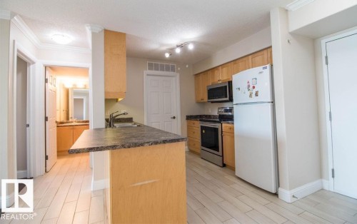 418 13111 140 Avenue, Edmonton, AB - Indoor Photo Showing Kitchen With Double Sink