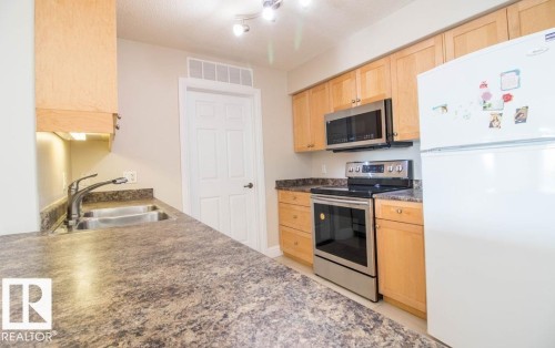 418 13111 140 Avenue, Edmonton, AB - Indoor Photo Showing Kitchen With Double Sink