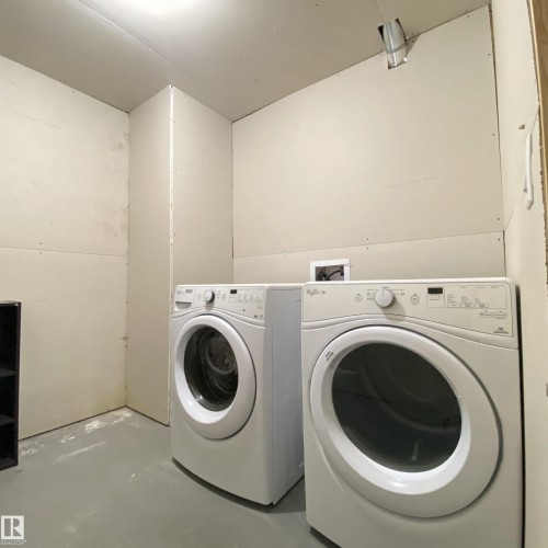 Dedicated laundry area featuring a washer and dryer setup - 1520 105 Street, Edmonton, AB - Indoor Photo Showing Laundry Room
