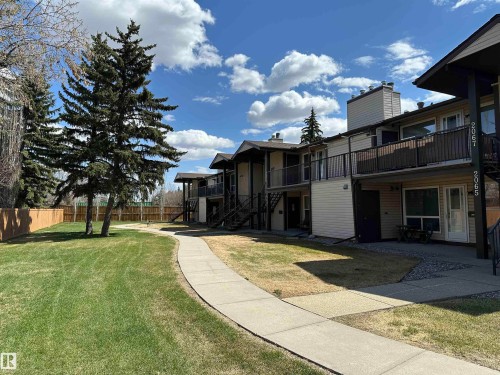 Multi-level residential building featuring exterior staircases and individual balconies - 2071 Saddleback Road, Edmonton, AB - Outdoor