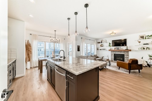 1 Governor Place, Spruce Grove, AB - Indoor Photo Showing Kitchen With Fireplace With Double Sink With Upgraded Kitchen
