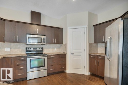 8 Kingdom Place, Leduc, AB - Indoor Photo Showing Kitchen With Upgraded Kitchen