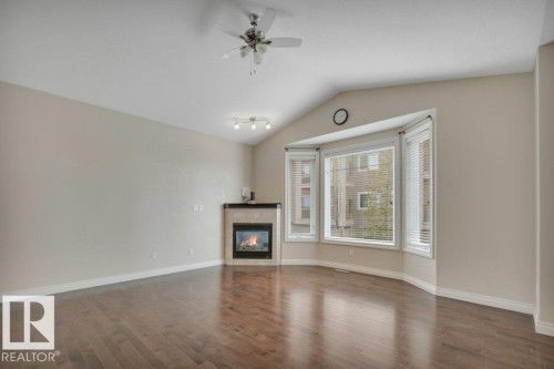 8 Kingdom Place, Leduc, AB - Indoor Photo Showing Living Room With Fireplace