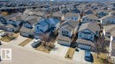 Residential street featuring multiple properties with attached garages - 1734 63A Street, Edmonton, AB  - Outdoor 