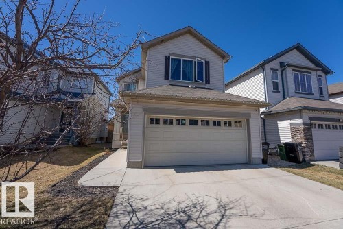 Two-story residence featuring light-colored siding and a gabled roofline - 1734 63A Street, Edmonton, AB - Outdoor With Facade