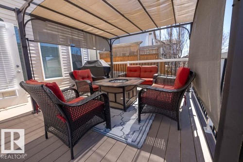 Outdoor deck featuring a pergola with retractable canopy, composite decking, and privacy screens - 1734 63A Street, Edmonton, AB - Outdoor With Deck Patio Veranda With Exterior