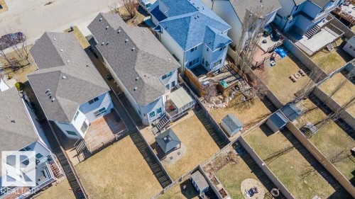 Expansive backyard featuring a wood deck, perimeter fencing, and a detached shed - 1734 63A Street, Edmonton, AB - Outdoor With View
