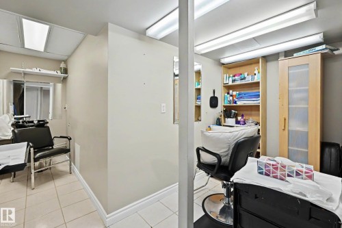 Versatile interior space featuring light-toned walls and white trim - 7723 7A Avenue, Edmonton, AB - Indoor