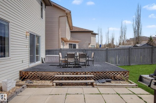 Expansive raised deck with lattice skirting and integrated stairs - 7723 7A Avenue, Edmonton, AB - Outdoor With Deck Patio Veranda