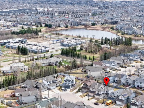 Aerial view highlighting the property within a residential area - 7723 7A Avenue, Edmonton, AB - Outdoor With Body Of Water With View
