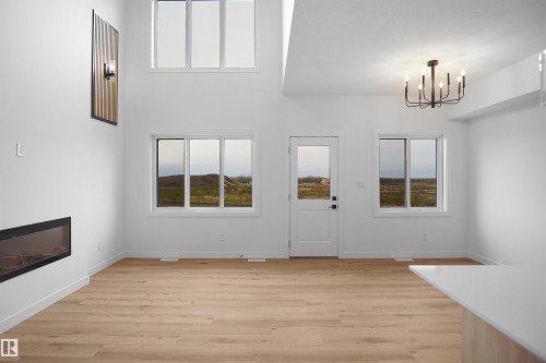 117 Peirwyck Loop, Spruce Grove, AB - Indoor Photo Showing Other Room With Fireplace