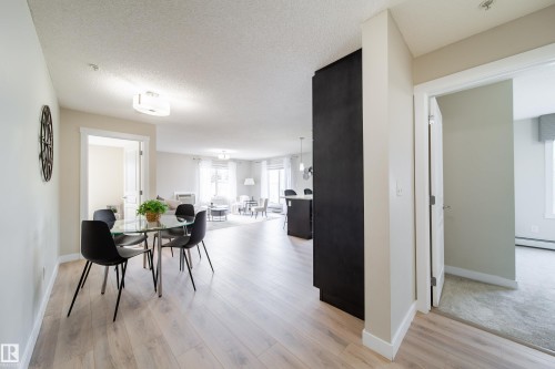 Bright interior featuring light wood-finish flooring throughout the main living areas - 117 2229 44 Avenue, Edmonton, AB - Indoor