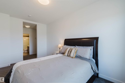 Bedroom - 205 1316 Windermere Way, Edmonton, AB - Indoor Photo Showing Bedroom