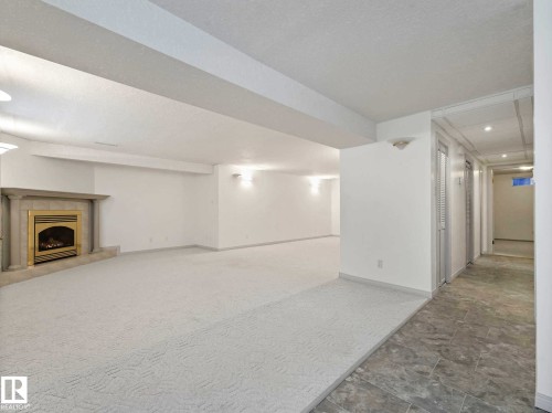6303 92B Avenue, Edmonton, AB - Indoor Photo Showing Other Room With Fireplace