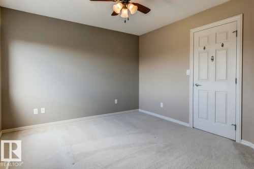 Room featuring neutral wall tones and light-colored carpeting - 119 Rue Monique, Beaumont, AB - Indoor Photo Showing Other Room