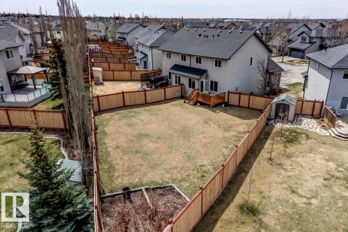 Expansive backyard with a full perimeter fence - 119 Rue Monique, Beaumont, AB - Outdoor