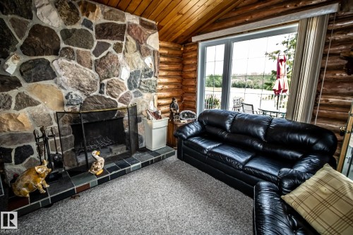 18 Horseshoe Bay Drive, Rural St. Paul County, AB - Indoor Photo Showing Living Room With Fireplace