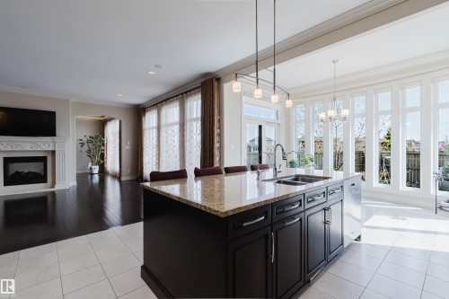 4118 Westcliff Heath, Edmonton, AB - Indoor Photo Showing Kitchen With Fireplace With Double Sink