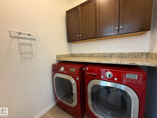 PHOTO OF THE MAIN FLOOR LAUNDRY ROOM WITH GRANITE FOLDING TOP! - 2335 Rutherford Way, Edmonton, AB - Indoor Photo Showing Laundry Room