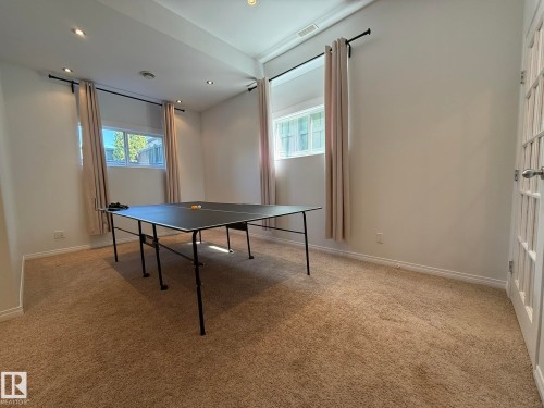 Spacious room featuring neutral carpeting and white baseboards - 2335 Rutherford Way, Edmonton, AB - Indoor Photo Showing Other Room