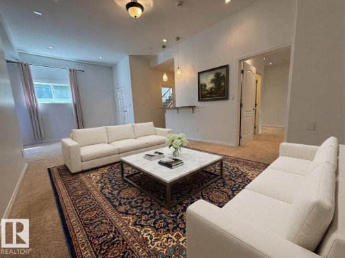 Carpeted living area featuring recessed lighting - 2335 Rutherford Way, Edmonton, AB - Indoor Photo Showing Other Room