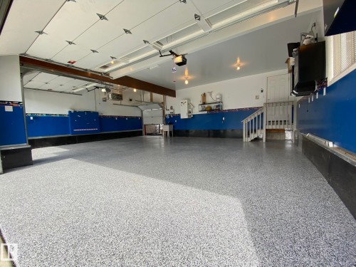 ANOTHER PHOTO OF THE INSIDE OF THIS AMAZING TRIPLE ATTACHED DRIVE-THRU GARAGE! - 2335 Rutherford Way, Edmonton, AB - Indoor Photo Showing Garage
