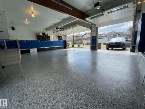 YOU WILL BE TRULY AMAZED OF THE HEIGHT OF THIS GARAGE WITH 8Ft OVERHEAD DOORS FOR YOUR BIG TRUCK TO FIT IN HERE WITH EASE... - 2335 Rutherford Way, Edmonton, AB - Indoor Photo Showing Garage