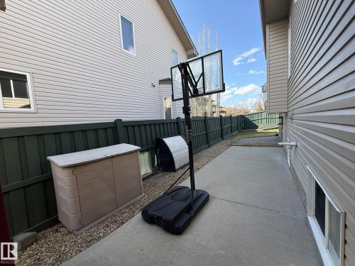ANOTHER PHOTO OF THE LONG DRIVEWAY BEHIND THE DRIVE-IN GARAGE DOOR! - 2335 Rutherford Way, Edmonton, AB - Outdoor With Exterior