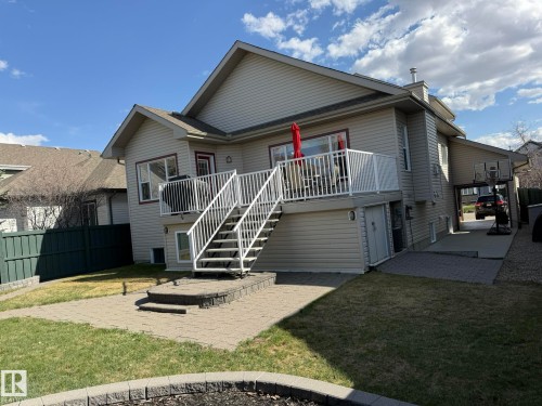 GREAT PHOTO OFTHE BACK OF THE HOUSE AND THE LARGE DECK WITH THE STORAGE SHED BUILT-IN UNDER THE DECK TO THE RIGHT OF THE PHOTO! - 2335 Rutherford Way, Edmonton, AB - Outdoor