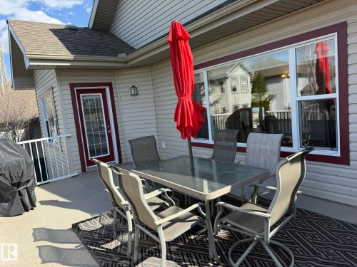 Exterior deck featuring textured flooring and white railings - 2335 Rutherford Way, Edmonton, AB - Outdoor With Deck Patio Veranda