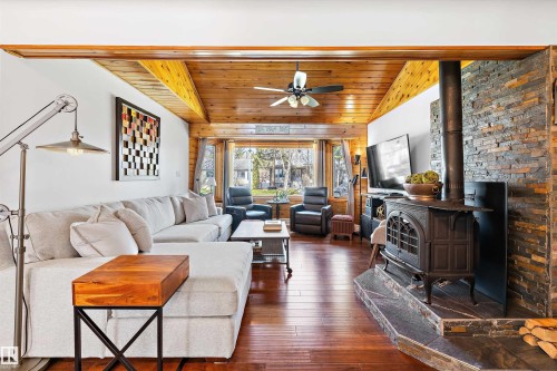 7739 80 Avenue, Edmonton, AB - Indoor Photo Showing Living Room With Fireplace