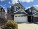 Two-story residence featuring a blue siding exterior with white trim accents - 16627 18 Avenue, Edmonton, AB  - Outdoor 