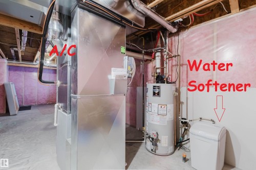 Dedicated utility space featuring a water heater, water softener, and HVAC system - 16627 18 Avenue, Edmonton, AB - Indoor Photo Showing Basement