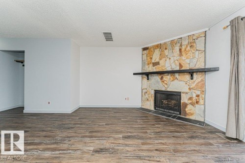 308 14004 26 Street, Edmonton, AB - Indoor Photo Showing Living Room With Fireplace