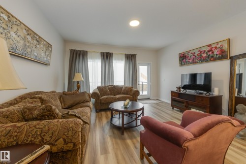 169 Stonehouse Way, Leduc, AB - Indoor Photo Showing Living Room