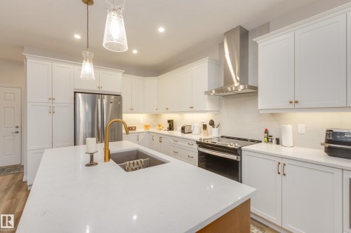 169 Stonehouse Way, Leduc, AB - Indoor Photo Showing Kitchen With Double Sink With Upgraded Kitchen