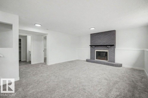 67A Arbor Crescent, St. Albert, AB - Indoor Photo Showing Other Room With Fireplace