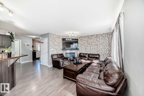 227 Avena Circle, Leduc, AB - Indoor Photo Showing Living Room With Fireplace