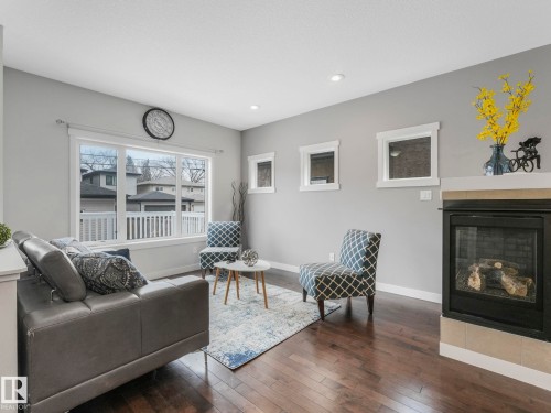 8318 79 Avenue, Edmonton, AB - Indoor Photo Showing Living Room With Fireplace