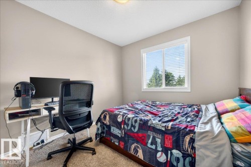 Neutral wall paint with textured carpeting - 18080 89 Street, Edmonton, AB - Indoor Photo Showing Bedroom