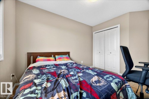 Bedroom featuring neutral wall paint, a single window, and bi-fold closet doors - 18080 89 Street, Edmonton, AB - Indoor Photo Showing Bedroom