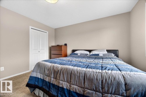 Neutral-toned walls and plush carpeting define this sleeping area - 18080 89 Street, Edmonton, AB - Indoor Photo Showing Bedroom