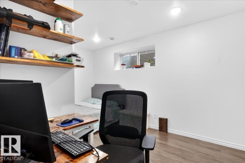 Interior room featuring wood-finish flooring and white walls - 18080 89 Street, Edmonton, AB - Indoor Photo Showing Office